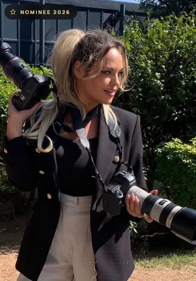 Photographer Chrissy Sparks with two cameras, UK Glamour Awards 2026 nominee